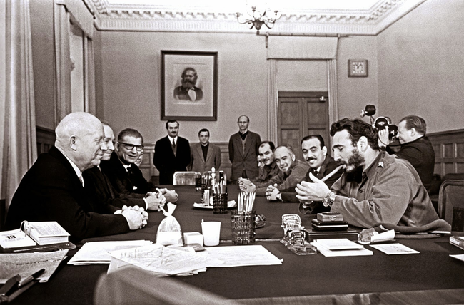 36.) Fidel Castro smoking a cigar and wearing two Rolex watches during a meeting at the Kremlin, 1963.