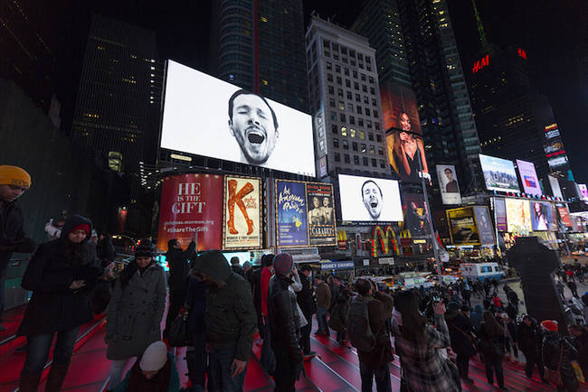 Sebastian Errazuriz yawning over the visitors in Times Square.