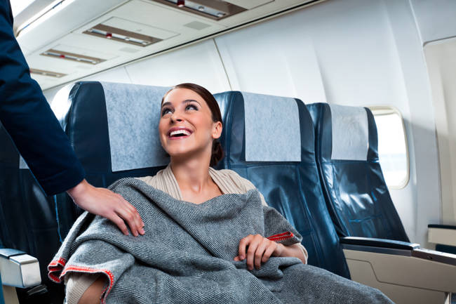 The pillows and blankets that flight attendants hand out are often reused.