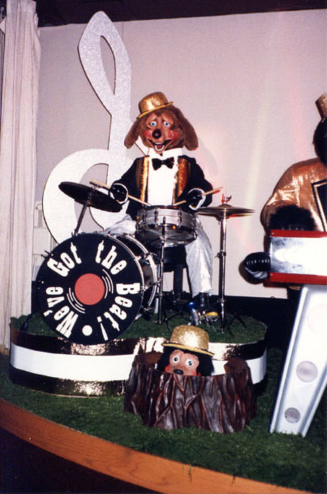 This doggie drummer looks fully aware that his creators forgot to program him with a soul.