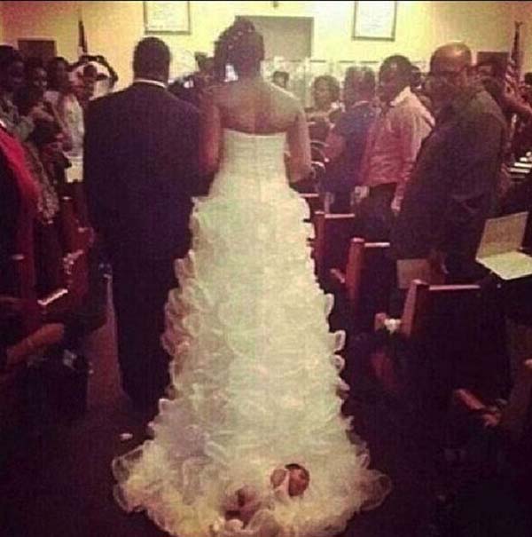 Shona Carter-Brooks tied her one month-old baby Audrey to her train and dragged her down the aisle.