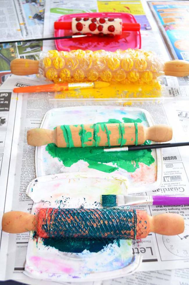 Wrap a textured material around a rolling pin and cover it in paint. Roll it over plain paper for a colorful design.