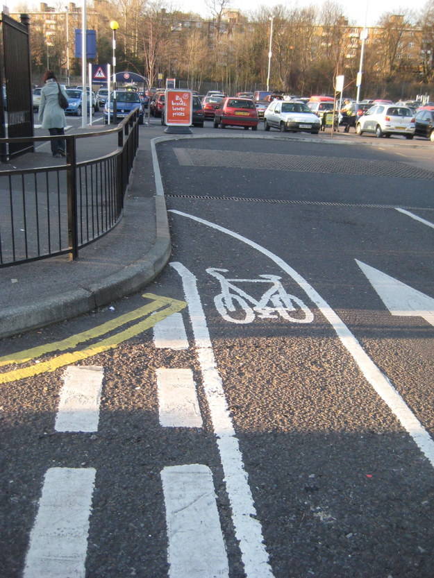 1.) Who's dumber... the guy painting the line or the biker who runs into the fence?