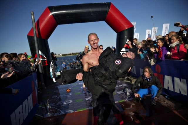 Now that the swimming portion is through, Steen and Peder head towards the bikes.