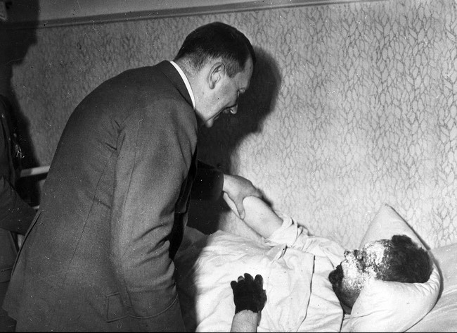 Hitler meets with an injured soldier. Year unknown.