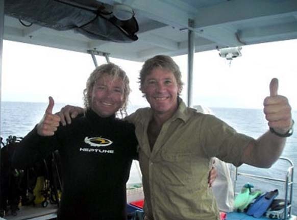 25.) Steve Irwin poses with marine biologist Chris Jones on his boat two days before his death in 2006.