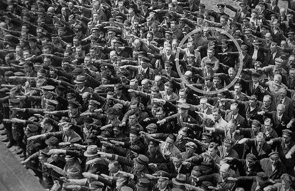 He stood alone, refusing to join the Nazi salute in 1936.