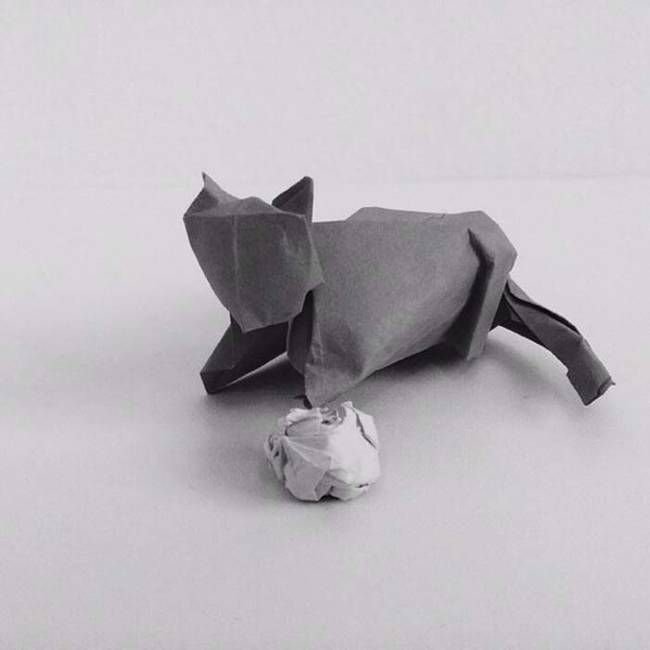 17.) Origami cat with her toy.