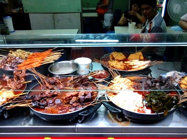 Known as malatang in China, these skewers of giblets, tofu, seaweed knots and mushrooms are dunked in spicy soup and eaten out of paper containers.