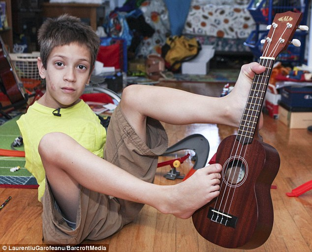 With Linda's help, he's taught himself to use his legs for just about everything, including playing guitar.