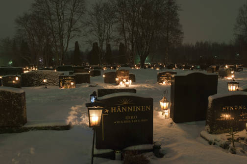 Some cemeteries use lanterns to protect the candles from the wind.