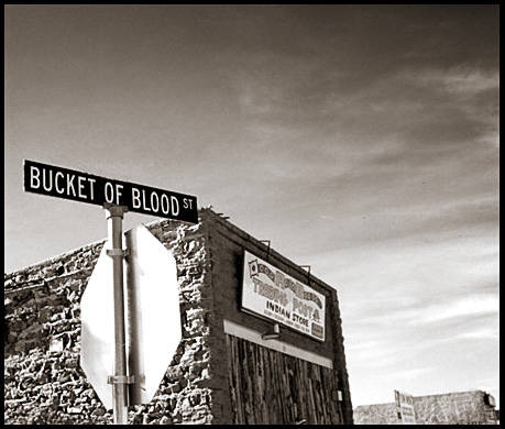 In Halbrook, Arizona, there is a street called Bucket of Blood. The story goes that in 1886, a gang of outlaws called the Hashknife Outfit killed 26 people in a town of just 250.  They slaughtered a rival outfit the same year, and no true body count was ever confirmed. The sheriff only said the streets were red with "buckets of their blood."