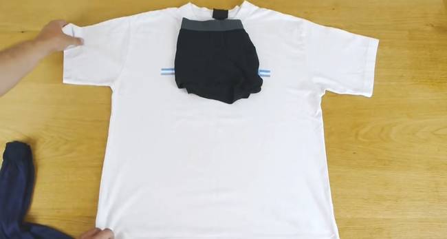 4. Here's a simple and space-saving way to pack for the night. Place your underwear on your t-shit and then fold the sides of the t-shirt over top.