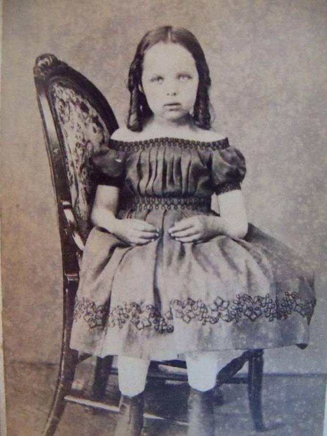 10.) Here this little girl is sitting sideways on the chair so that the device propping her up is hidden.