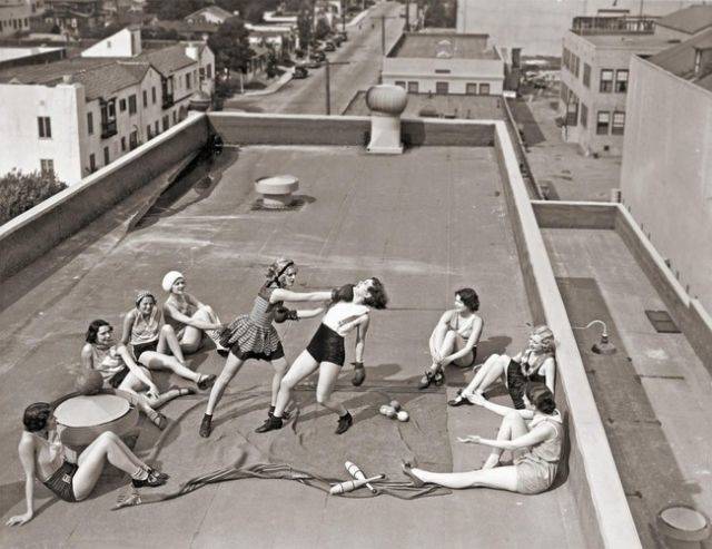 Women boxing on a rooftop in Los Angeles in the 1930s.