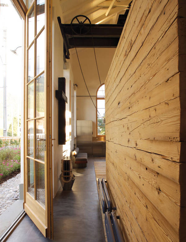 Reclaimed and treated wood from the old station is present throughout the house.