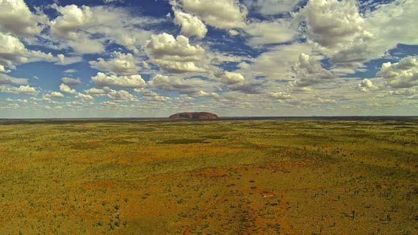 29.) A serene view of Ayers Rock (Australia).