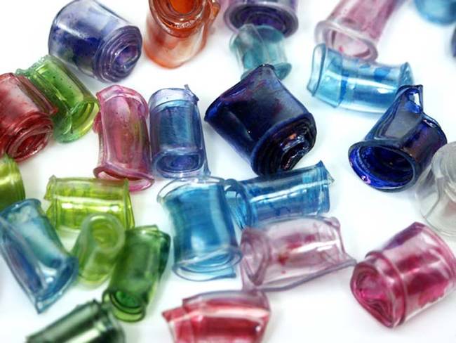 Colored plastic soda bottles can be fashioned into beads with a little heat.