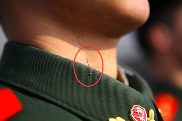 1.) To train soldiers to keep their chins up, a pin is precariously hanging in the collars of their uniforms.