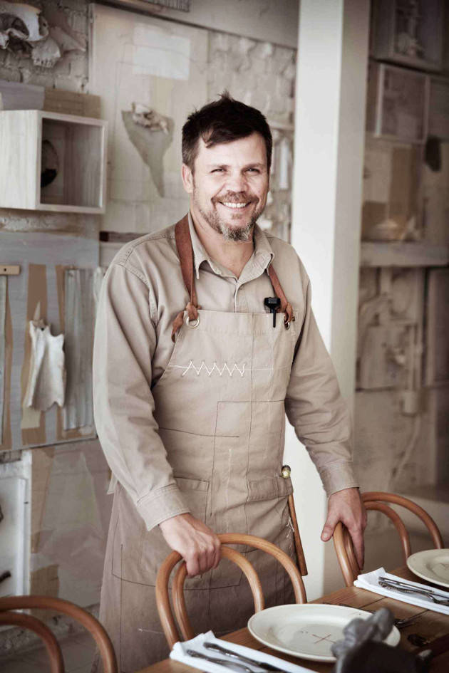 No Bones to Pick: Chef Alfonso Cadena beaming proudly in his new restaurant.