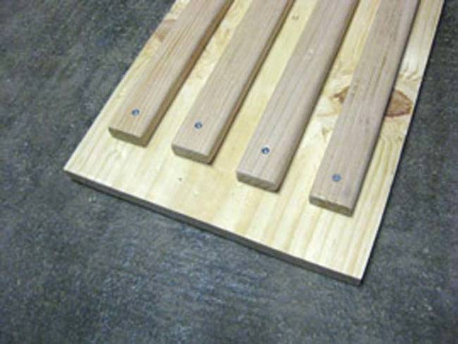 Nail the strips to the plywood board, they will act as the frame for the rope lights.