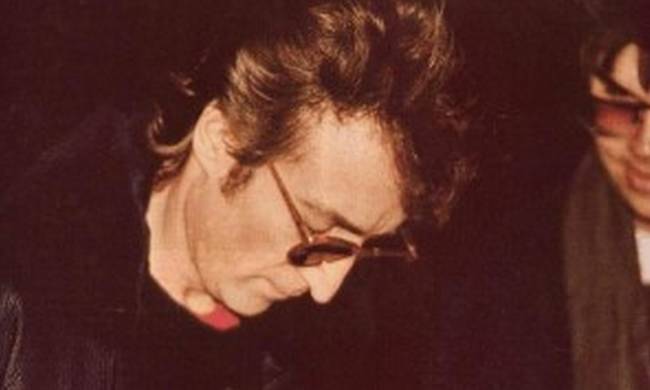 1.) The last photograph taken of John Lennon while he was living was this one here, taken with his killer, Mark David Chapman.