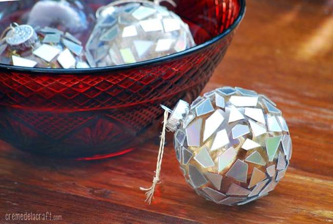 Don't use CDs anymore? Make <a href="https://www.cremedelacraft.com/2012/11/DIYOrnaments.html">shiny mosaic ornaments</a> out of your old discs.