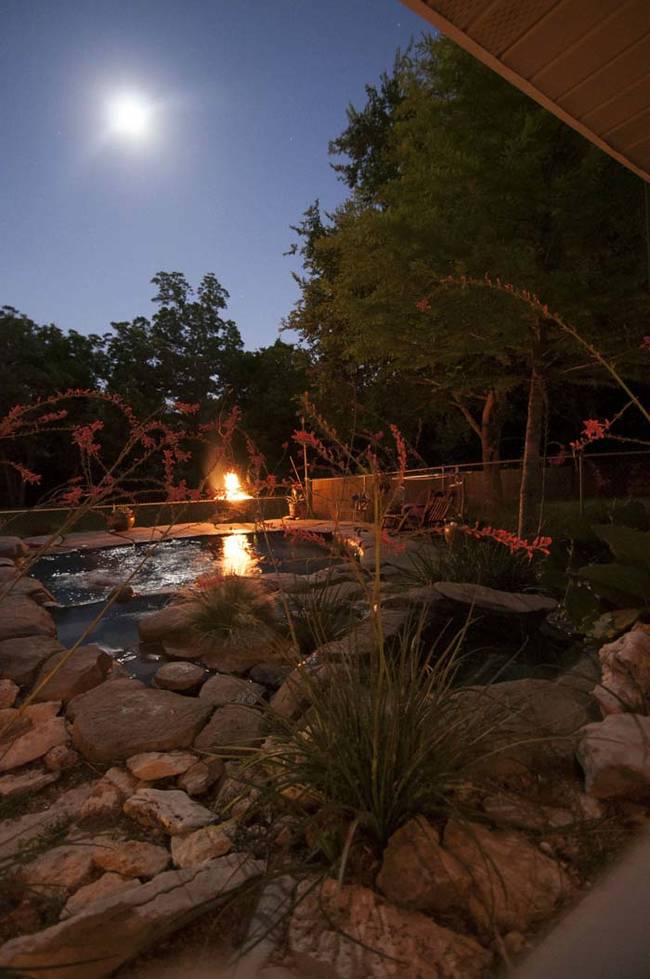 For a finishing touch, he built a raised fire pit next to the pool.