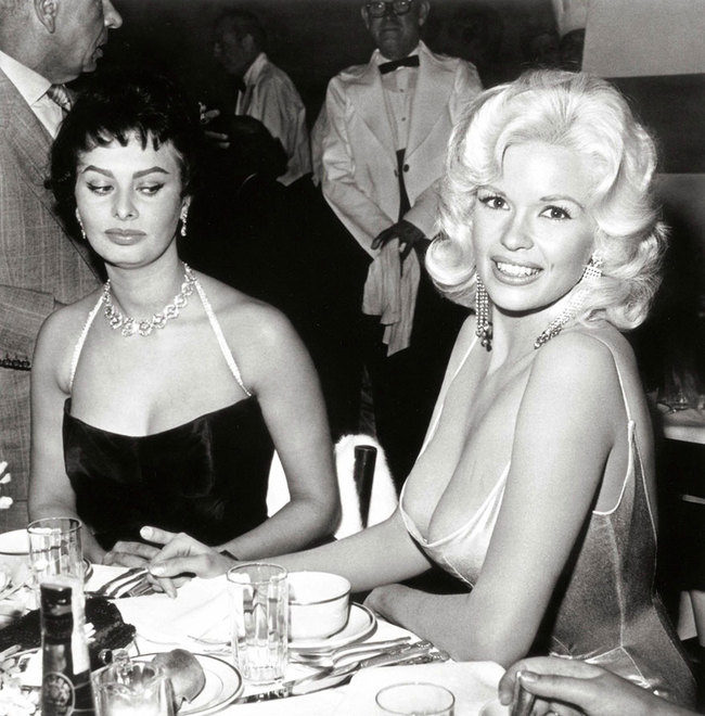 5. Envy - Sophia Loren has a envious eye on Jayne Mansfield at a 20th Century Fox party thrown in Sophia Loren’s honor April 12th, 1957.