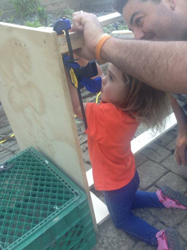 Here's dad and daughter assembling the bed frame.