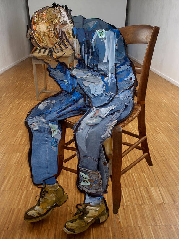 Denim and furniture create this rendition of Vincent Van Gogh's <i>At Eternity's Gate</i>. While the image appears to be vertical, it's an illusion created by laying the items on the floor across a room, and then viewing the assemblage from a particular angle.