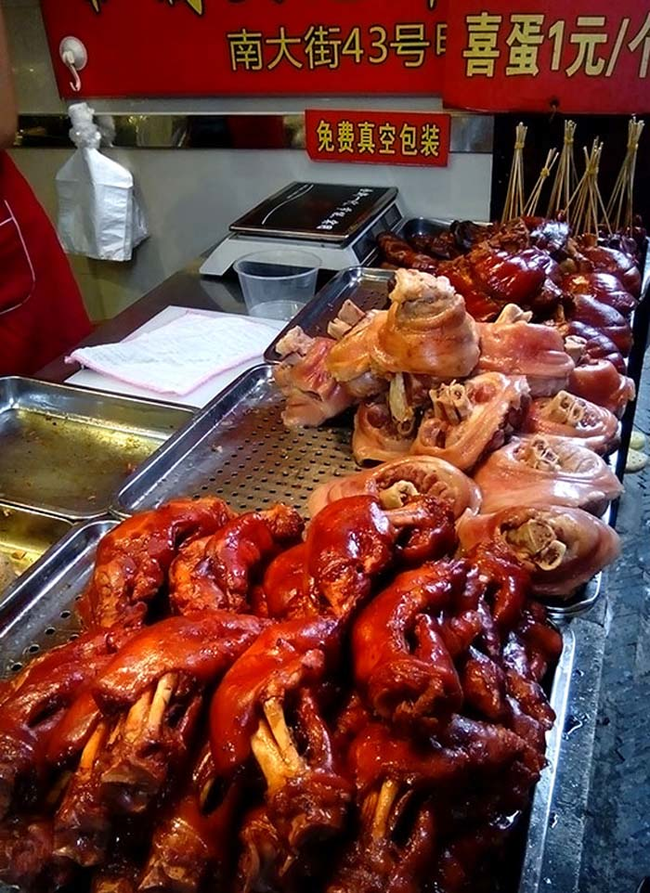 Marinated pork legs could be bought whole. After being purchased, they're chopped up so they can be eaten right out of the bag.