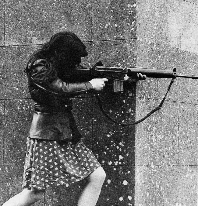 38.) Female IRA fighter showing off her assault rifle in the 1970's.