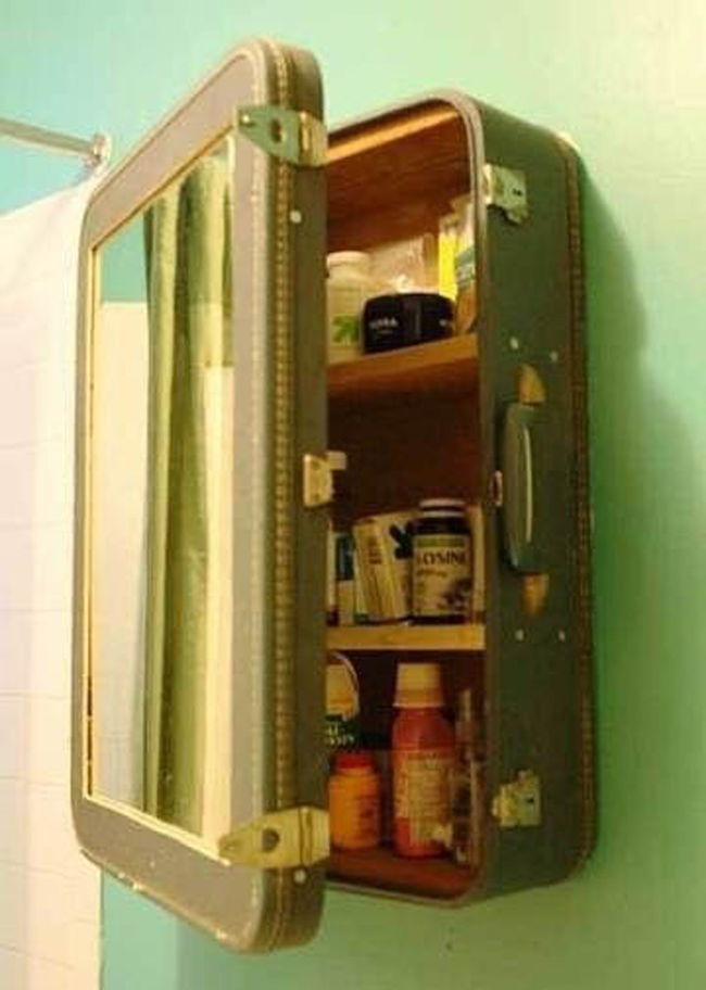 20.) Use an old suitcase to create a medicine cabinet.
