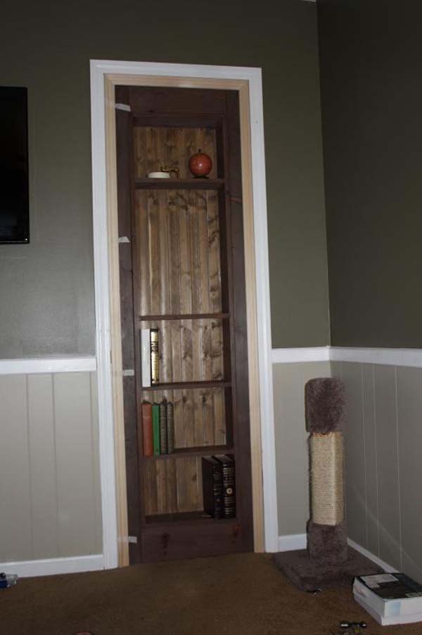 Once the door was hung, the hinges and space around the frame was covered by simple door trim that was added.