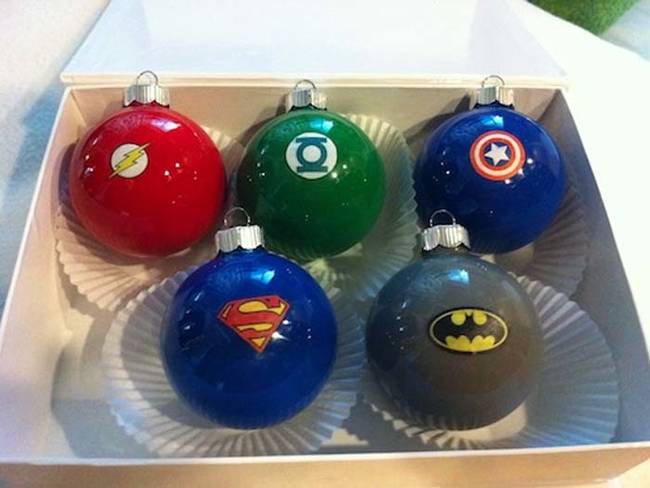 Make a set of superhero ornaments with just paint and printed logos.