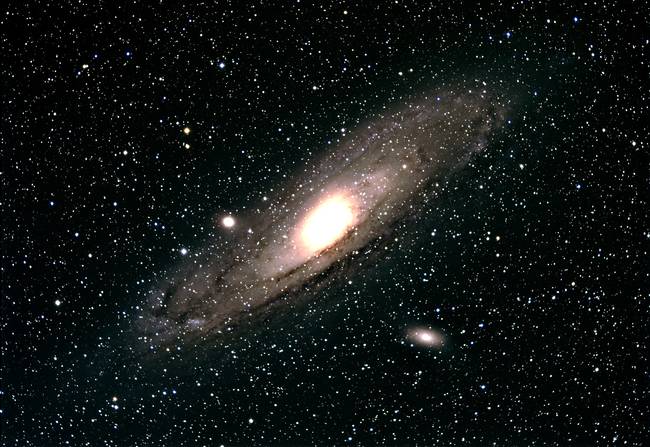 You can see another galaxy with the naked eye: The Andromeda Galaxy, 2.2 million light years away.