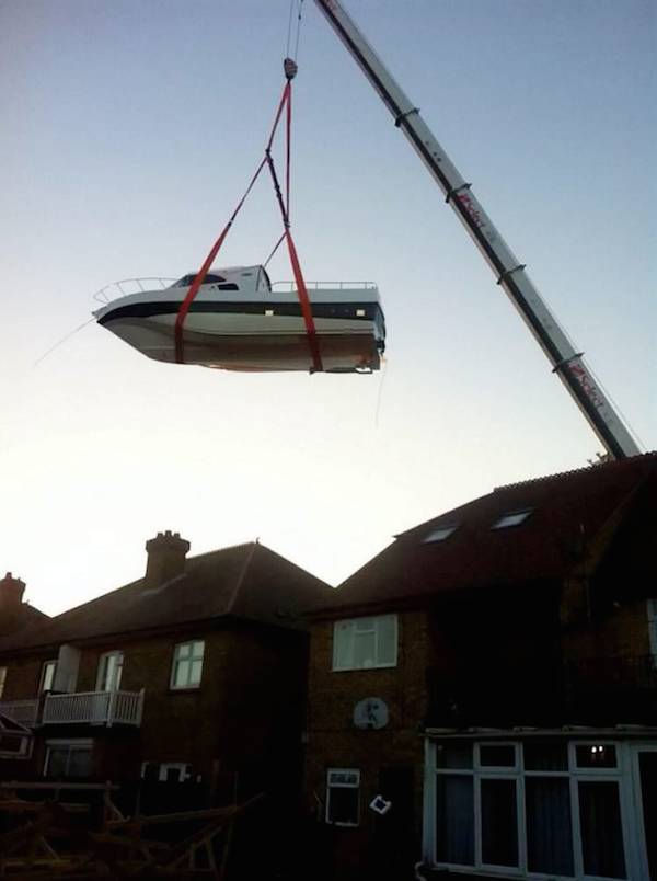 Once it was completed, the Couzens realized that the boat was so big that it would be quite a task to get the boat out of the backyard. They had to take a little bit of a financial hit to rent a huge crane to lift the boat on to a truck to be transported to the harbor.