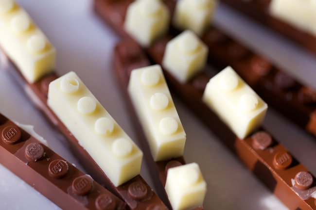 To make them, chocolate is first poured into precisely designed moulds that after cooling can be popped out and used as regular Legos.