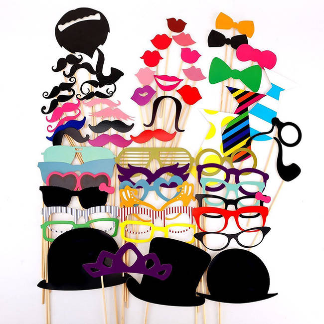 Purchase <a href="https://www.amazon.com/Colorful-Mustache-Wedding-Christmas-Birthday/dp/B00LAWFCYG/ref=sr_1_1?ie=UTF8&qid=1418246849&sr=8-1&keywords=Photo+Booth+props=vira0d-20">foam photo booth props</a> in bulk, and let your party guests take them home as favors.