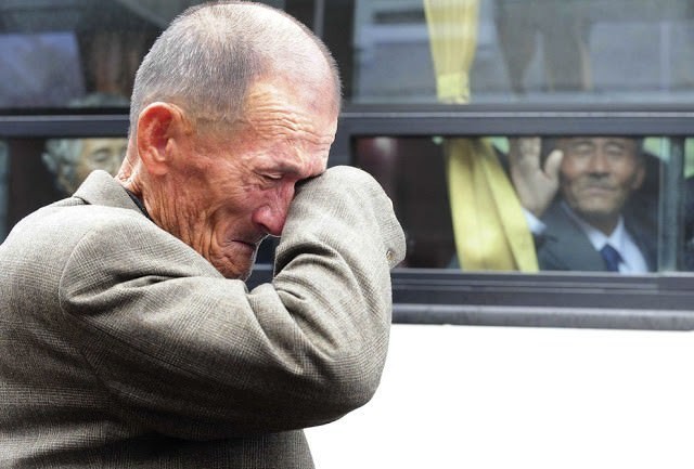 5.) A South Korean man cries as his North Korean brother waves after inter-Korean temporary family reunions.