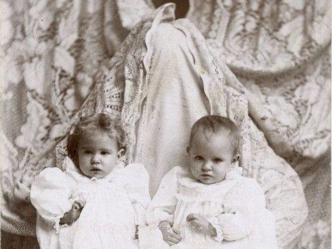 This mom attempted to blend in by choosing a lace white drape. The result looks like the Mothman came to babysit.