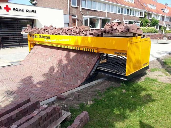 5.) A path-laying machine that weaves bricks together.