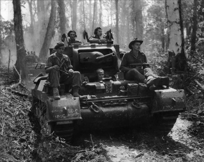 28.) A Matilda tank of the Australian 2/4th Armored Regiment on the Buin Road, Bougainville (1945).