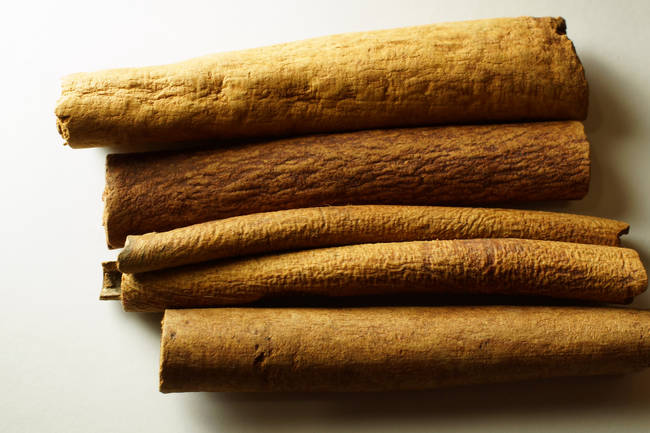 Above an average of 400 or more insect fragments per 50 gram and an average of 11 or more rodent hairs per 50 grams will cause FDA intervention for ground cinnamon.