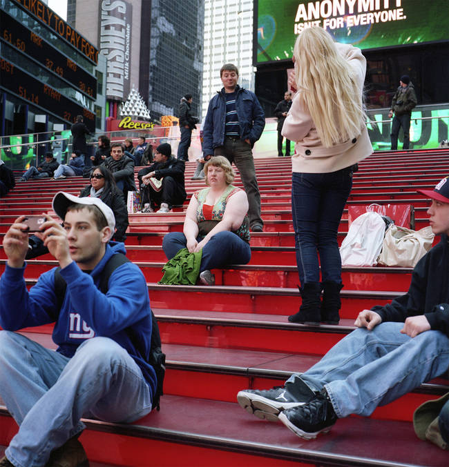 The photo that started it all. Here, a man sneers at Morris-Cafiero as she sits on the steps. What he didn't know was that she ended up seeing him, too.