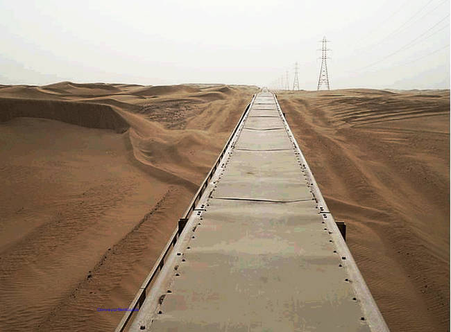 Making it, despite the winds, the longest and most productive conveyor belt in the world.