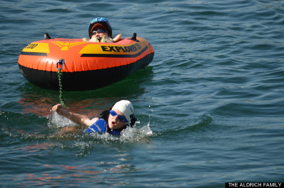 ...and swam across the finish line with Lucas in tow.