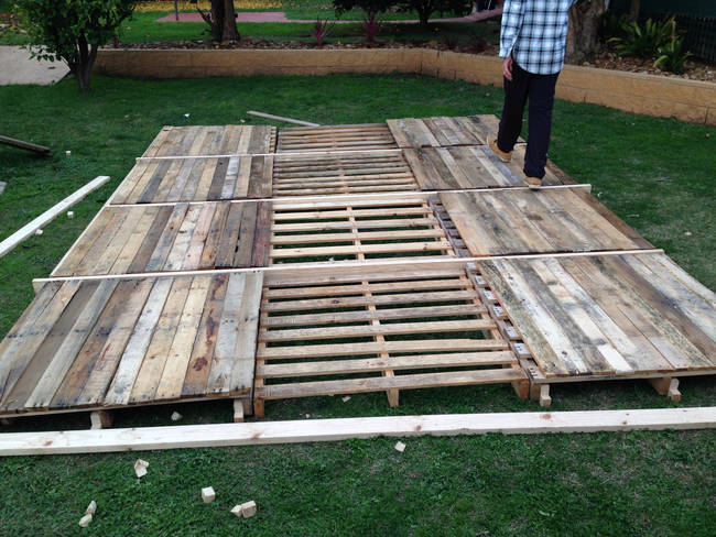 Once the bottom portion of the raft was put together, they used more wood from the pallets to reinforce the raft for sitting and standing.