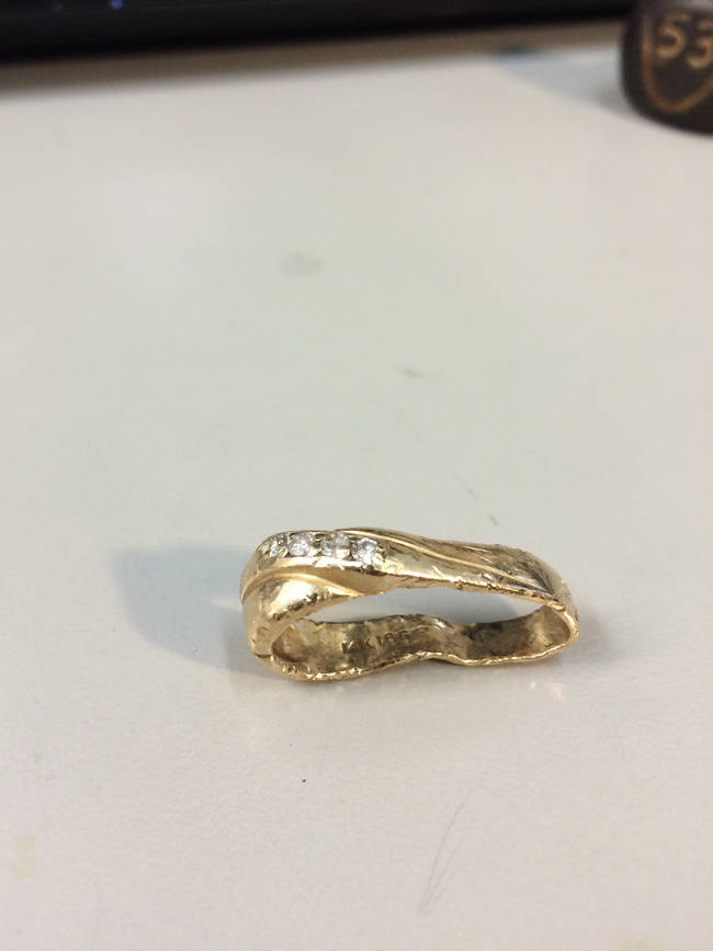 Here's the poor ring that went through the garbage disposal.